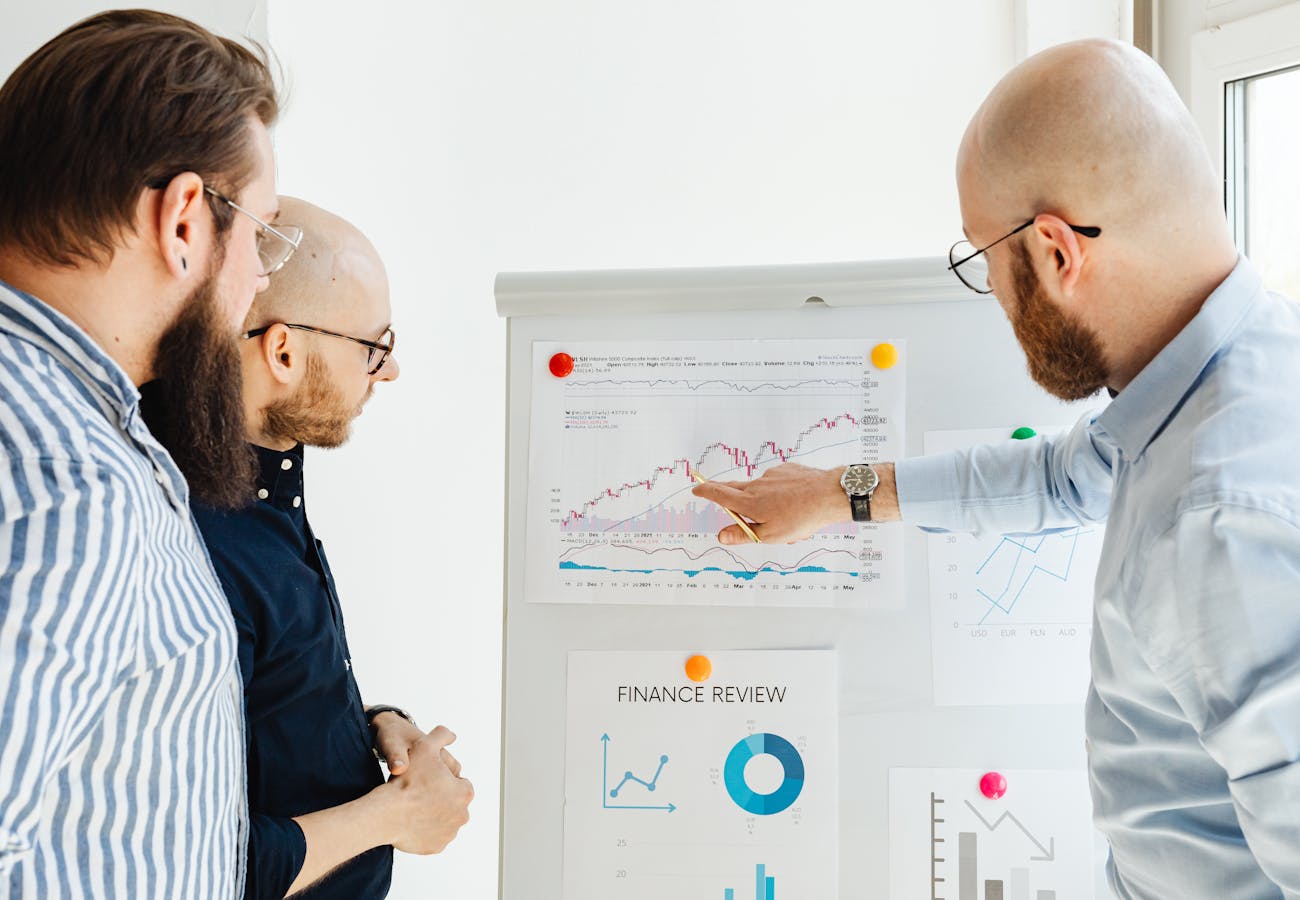 Financial professionals reviewing charts